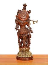 Krishna brass flute sculpture rear view with round shield motif and flared headdress