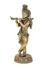 Standing Lord Krishna idol sculpture playing flute, intricate detailing on gold-toned attire
