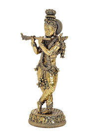 Standing Lord Krishna idol sculpture playing flute, intricate detailing on gold-toned attire