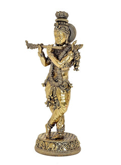 Standing Lord Krishna idol sculpture playing flute, intricate detailing on gold-toned attire
