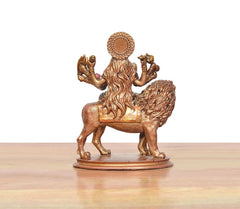 Back view of Durga Maa resin idol on lion, sculpted mane and crown halo