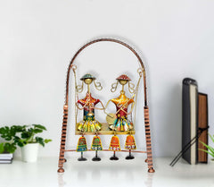 Multicolour jhula showpiece with two hanging musician figures on a tabletop stand
