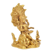 Brass Dakshinamurti Shiva statue, angled view, seated figure with halo and small devotees