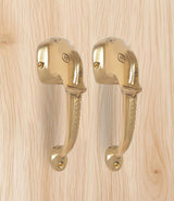 Brass Ganesha face door handle pair, polished finish with embossed face details