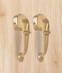 Brass Ganesha face door handle pair, polished finish with embossed face details