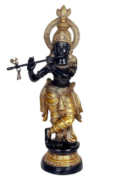 Krishna bronce dorado con manos cruzadas, corona y tridente; figura azul oscuro