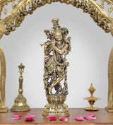 Brass Lord Krishna idol holding a flute, ornate standing figure on a pedestal, 10 inch