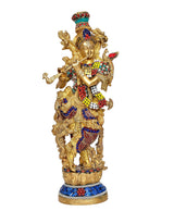 Brass Lord Krishna statue standing pose, ornate gold details, jeweled blue outfit
