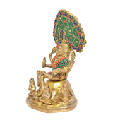 Brass Dakshinamurti Shiva statue side view, multicolor jeweled halo and small attendants