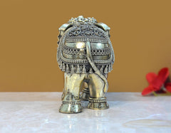 Brass elephant figurine rear view, embossed patterned drape, 5 in tall