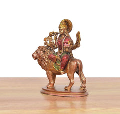 Resin Durga Maa with lion idol, front-left view; pink sari and golden ornaments
