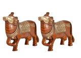 Brass Kamdhenu cow pair wall hanging, side view with decorative saddle patterns