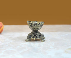 Superfine brass tortoise oil lamp diya with detailed engraving, rear angled view