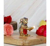 Messingfigur der Ganesha-Maus mit Öllampe, bunte Schmucksteine an Augen und Hals