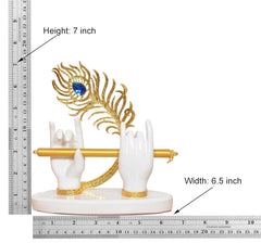 White resin Krishna hands with gold flute, blue peacock motif; 7 in height, 6.5 in width