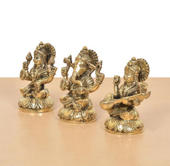 Brass Lakshmi Ganesha Saraswati idol set, rear view showing ornate backs and ornaments