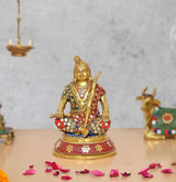 Brass Ram Lala seated statue with colorful jeweled ornaments, raised sword and gold base