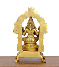 Rear view brass Saraswati goddess idol inside arched halo, detailed back