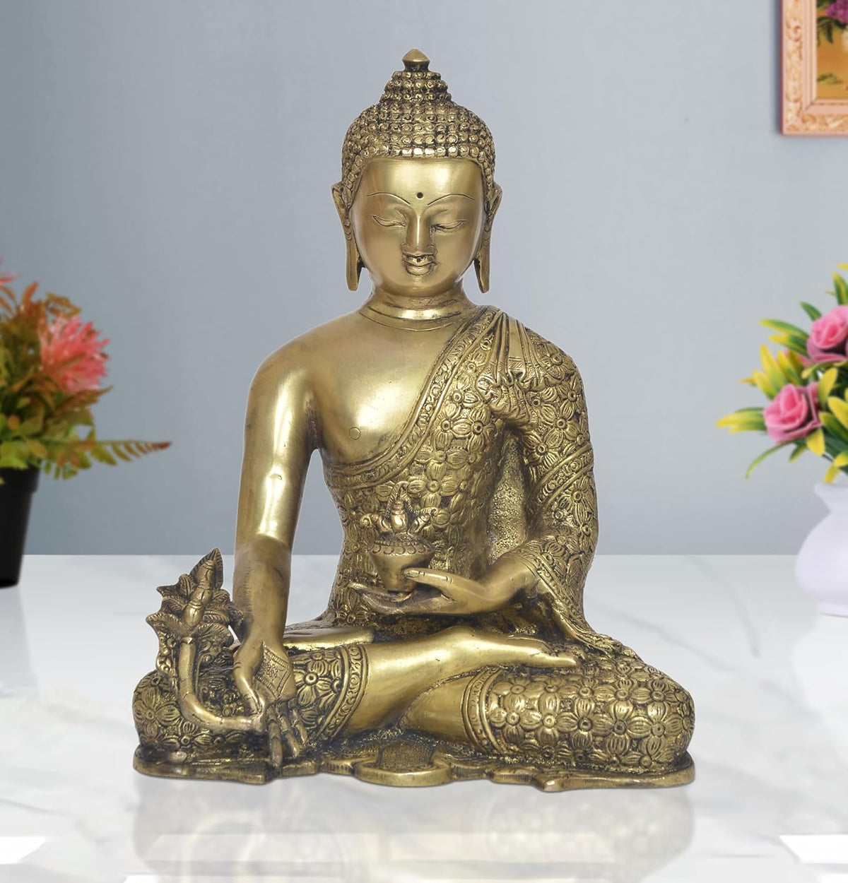 Brass meditating Buddha statue in Dhyan mudra, seated cross-legged, ornate robe