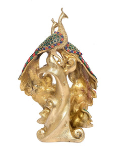 Gold-tone brass peacock figurine with detailed tail and colorful top inlay