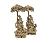 Brass Lakshmi and Ganesha statue pair with decorative chatri, side angles