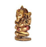 Resin Ganesha decorative figurine side view, gold finish with red-green detailing, round pedestal base