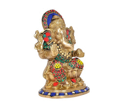Brass Ganesha murti angle view, multicolor jeweled robe and blue base trim