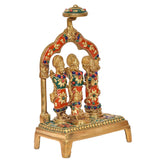 Brass Ram Darbar statue angled view, three adorned figures under jeweled arch frame