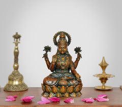 AONA Superfine Brass Lakshmi idol, seated figure with four arms holding lotus motifs