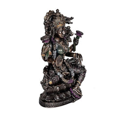 Lakshmi idol statue, profile view, holding ornaments, engraved base with purple accents