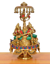 Front view brass Lakshmi-Ganesha-Saraswati idol on moving chowki with multicolor details