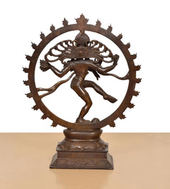 Brass Shiva Nataraj idol rear view, ornate circular halo and pedestal base