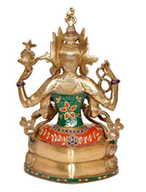 Rear view Tara Devi brass idol, four-armed seated form, green top and red skirt