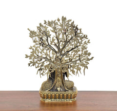 Brass-gold Buddha tree showpiece, back view of tall trunk and spread leaf branches