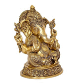 Golden brass Ganesha statue, detailed ornaments, seated with one hand raised
