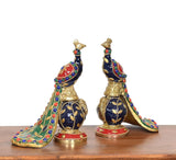 Close view brass peacock figurines with dark blue body, gold scales, multicolor trim