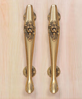 Gold brass door pull handles pair with lion face engravings and round rosette backs