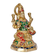 Lakshmi brass statue profile view with ornate headdress and four raised hands