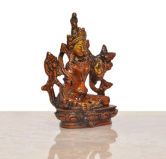 Tara Devi brass statue from side view, ornate crown, arms raised, decorative pedestal; 4 inch