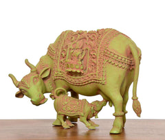 Side view brass cow with calf, ornate back panel featuring Lakshmi relief