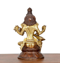 Back view brass Saraswati statue with veena, rounded crown and patterned back plate