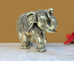 Brass elephant figurine side view, engraved face and decorative ear, 5 in tall