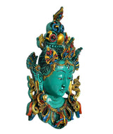 Green Tara wall hanging mask statue, side profile with colorful crown and raised hands