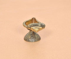 Top view of brass conch shankh oil diya lamp bowl with beaded border and carved base