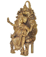 Golden brass seated Ganesha statue, side view with intricate drapery and ornaments