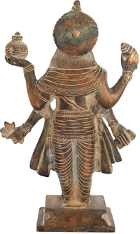 Brass Dhanvantari idol rear view, circular halo, patterned robes, raised arms.