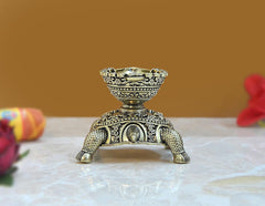 Brass tortoise diya statue, front view with central motif and decorative oil-lamp bowl