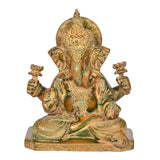 Brass Lord Ganesha idol, seated pose with detailed jewelry and decorative halo