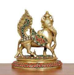 Brass Kamadhenu cow figurine, side view with jeweled chest and patterned base