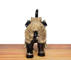 Brass elephant figurine, back view, gold back ornamentation and two bell charms